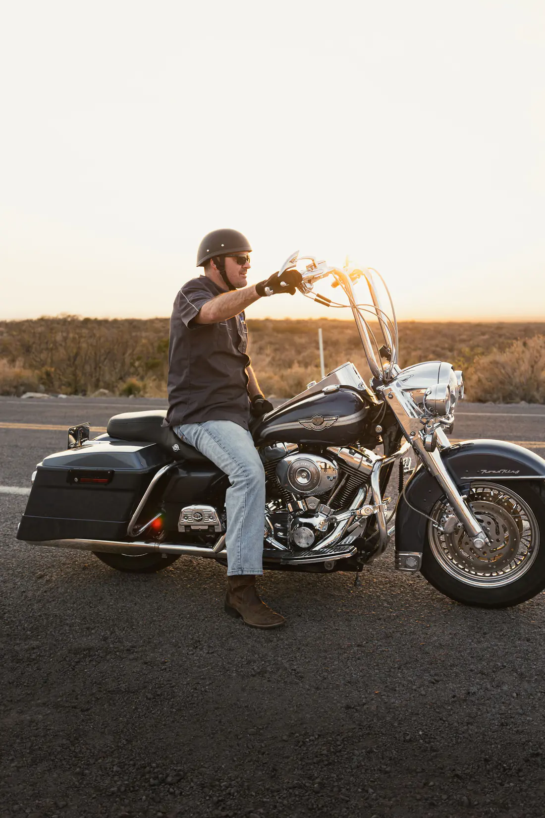 Illustrative stock photograph of a cruiser motorcycle rider outdoors