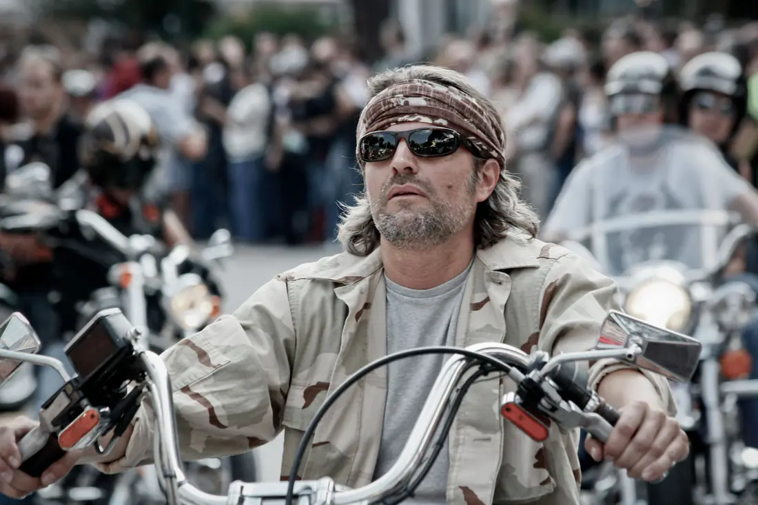 Illustrative stock photograph of a motorcycle rider at a public event