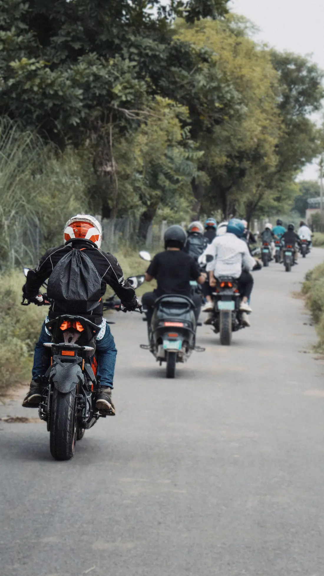 Illustrative stock photograph of several motorcycle riders travelling on a public road