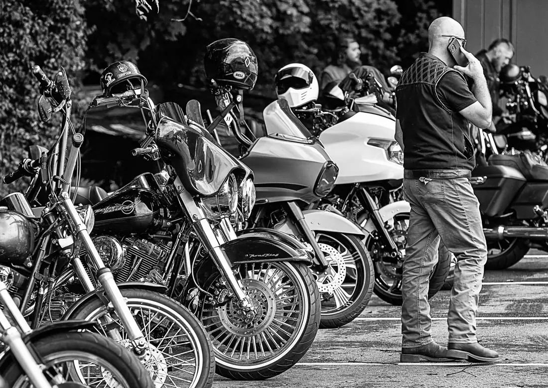 Illustrative stock photograph of motorcycles gathered in a public lineup