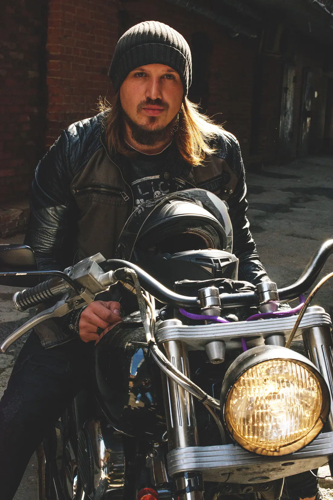Illustrative stock photograph of a motorcycle rider in a night portrait